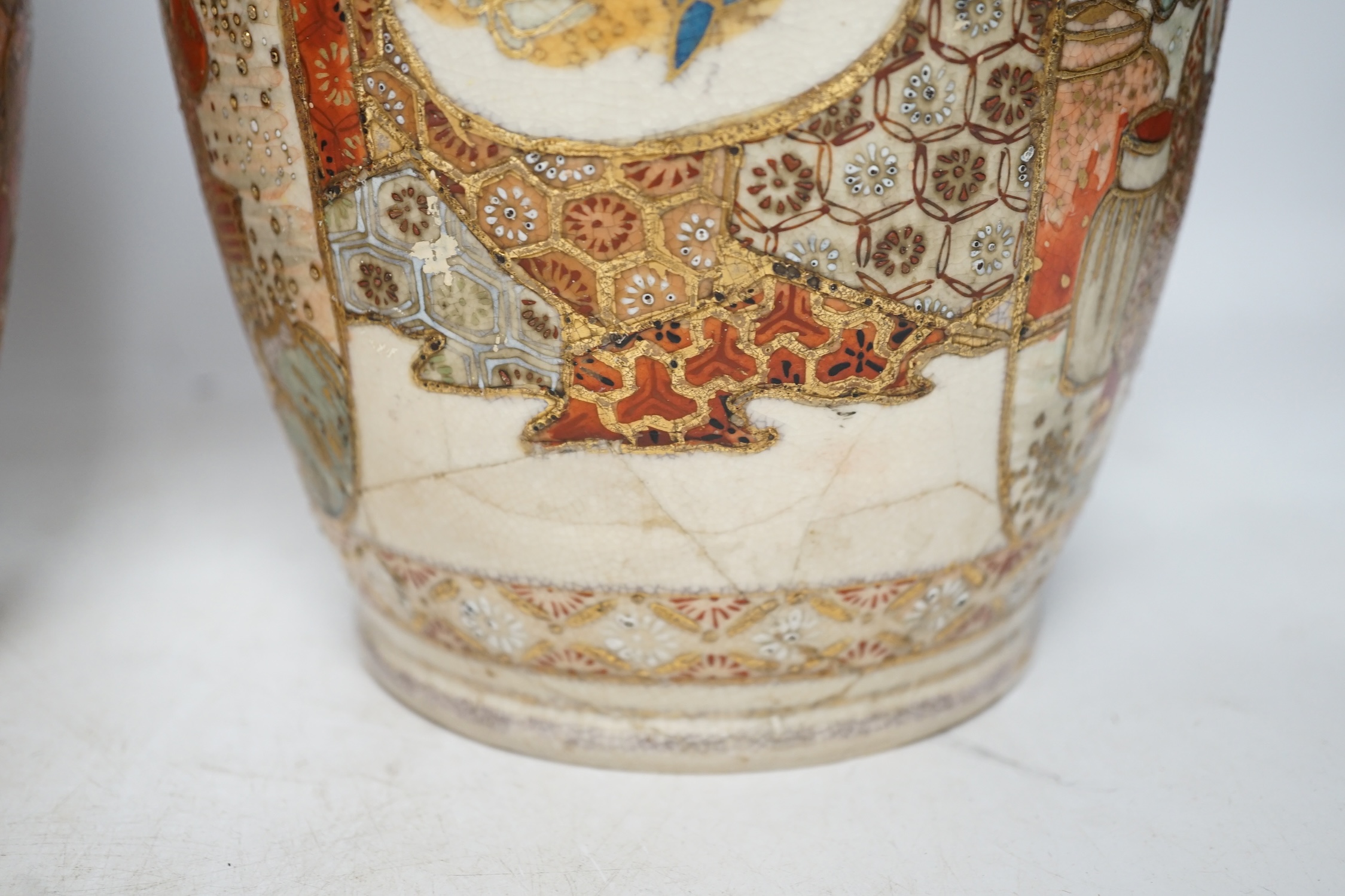 A pair of early 20th century Japanese Satsuma vases, 31cm high. Condition - poor, one repaired